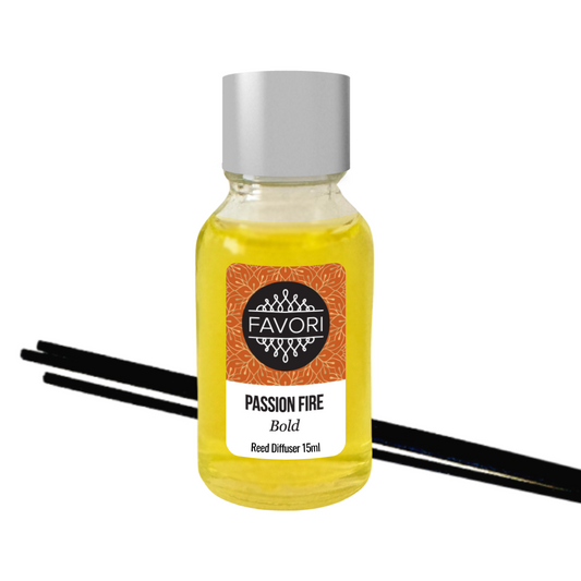 A bottle of FAVORI Scents Passion Fire Mini Reed Diffuser with fiber reed sticks. The bottle is labeled and contains yellow liquid.