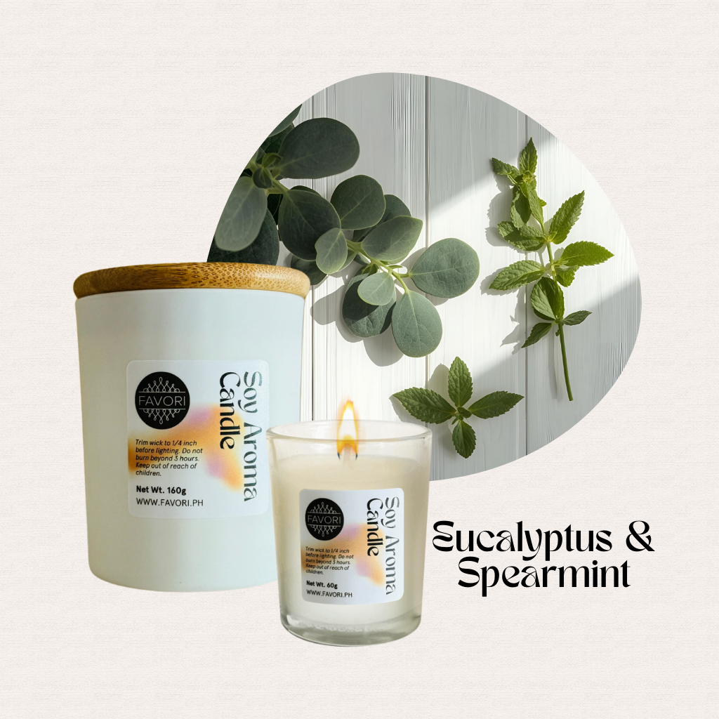 A premium FAVORI Scents All Occasion soy candle with fresh leaves and a burning flame on a light background.