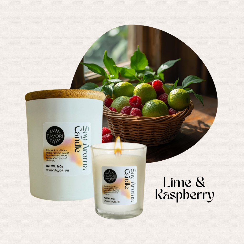 A lit FAVORI Scents All Occasion soy candle with its container; limes and raspberries in the background.