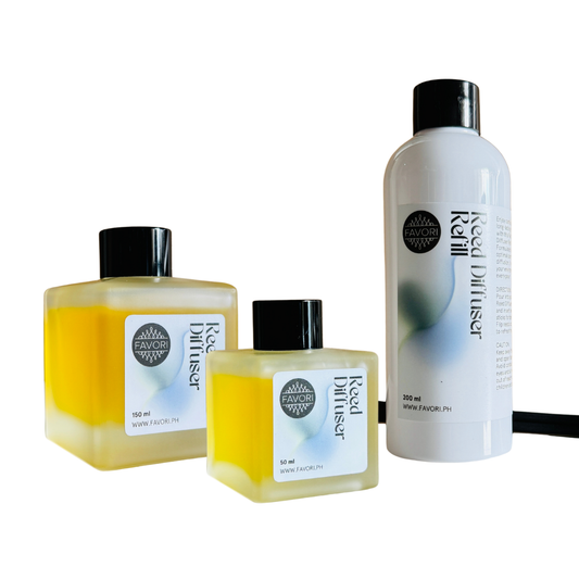 Three FAVORI Scents Trio Reed Diffuser bottles with fiber reeds and yellow liquid on a white background.