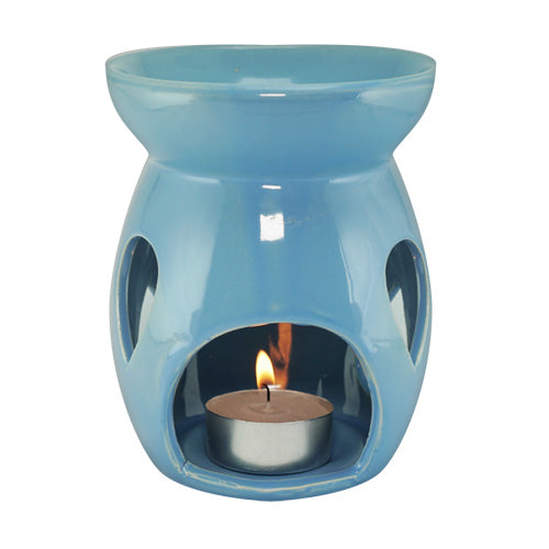 Blue FAVORI Scents ceramic oil burner with a lit tea light candle, a favorite for many.